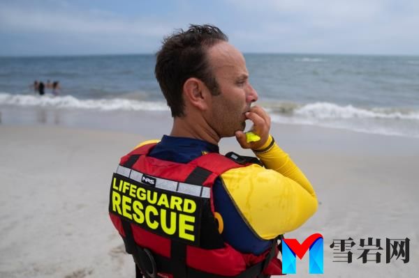 Cary Epstein, lifeguarding supervisor, mo<em></em>nitors the beach as his colleagues perform a shark patrol on a jet ski at Jo<em></em>nes Beach State Park, Thursday, July 6, 2023, in Wantagh, N.Y.