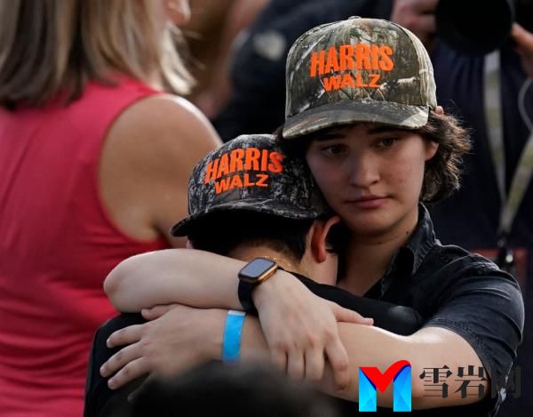 Supporters of Vice President Kamala Harris embracing at Howard University after her co<em></em>ncession speech in the 2024 U.S. presidential election.