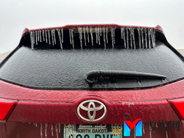 Ice coats a vehicle in Bismarck, N.D., on Tuesday, Dec. 26, 2023.