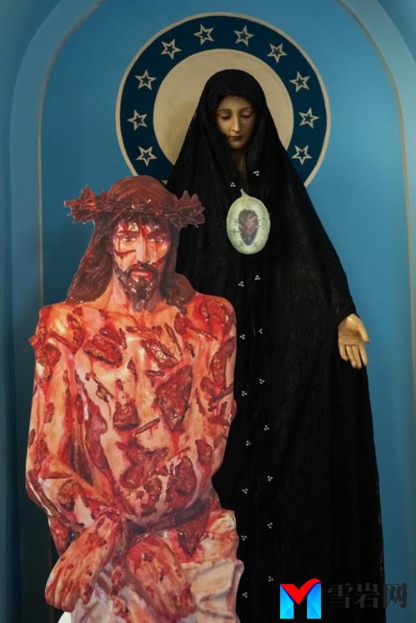 The bloody Jesus cut out sits next to a statue of the Virgin Mary cloaked in a black robe.