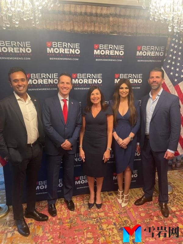 Do<em></em>nald Trump Jr. and Kimberly Guilfoyle pose for a photo with a group of people in Powell to support Bernie Moreno