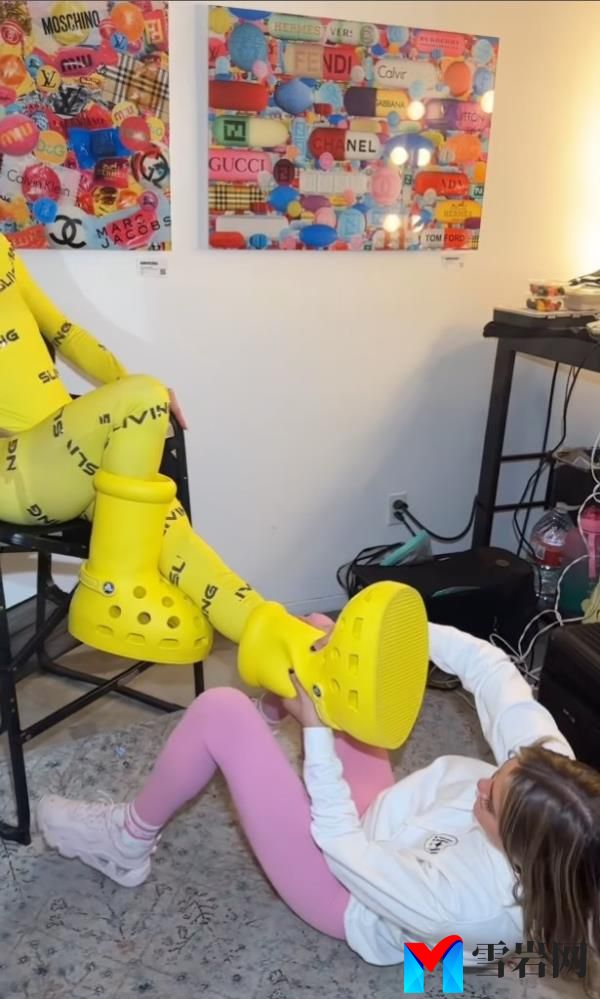Someone on the floor trying to take the boot off