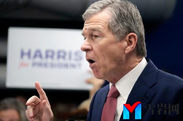N.C. Governor Roy Cooper speaking at a press conference, being co<em></em>nsidered as potential running mate for Vice President Kamala Harris in 2024 election