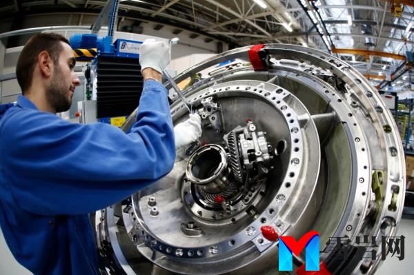 A technician works on an CFM56 civil aviation jet engine.