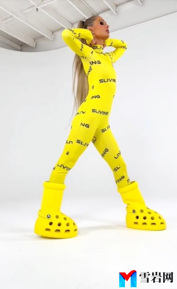 Paris in the MSCHF X Crocs boots and Sliving jumpsuit