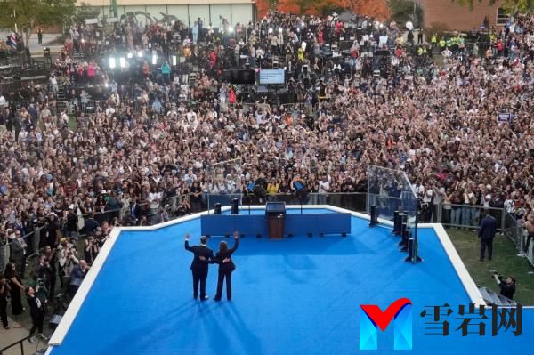 Vice President Kamala Harris and her husband, Doug Emhoff, waving to the crowd at Howard University after her co<em></em>ncession speech for the 2024 presidential election.