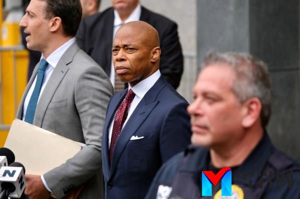 NYC Mayor Eric Adams leaving Federal Court, dressed in a suit, after pleading 