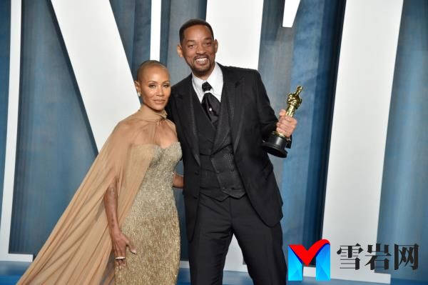 Will Smith and Jada Pinkett Smith pose with Will