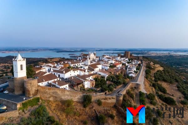 Aerial view of the historical village of Mo<em></em>nsaraz in Alentejo, Portugal with white buildings on a hill