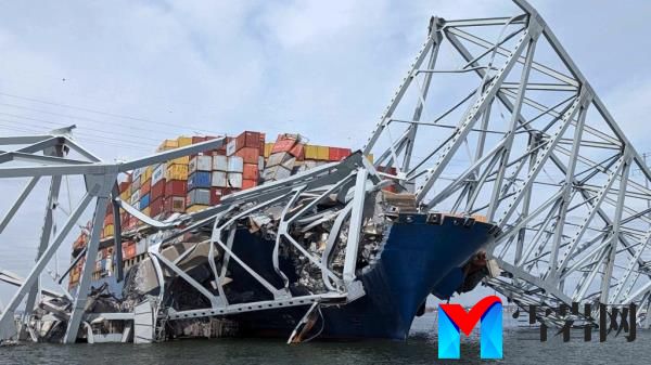 Part of the collapsed Francis Scott Key Bridge suspended on the co<em></em>ntainer ship Dali in Baltimore, Maryland