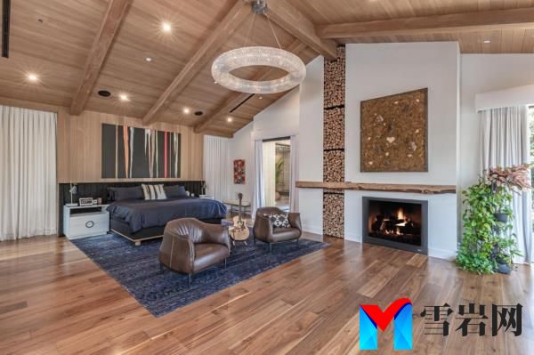 Interior of a room with a handsome fireplace. 