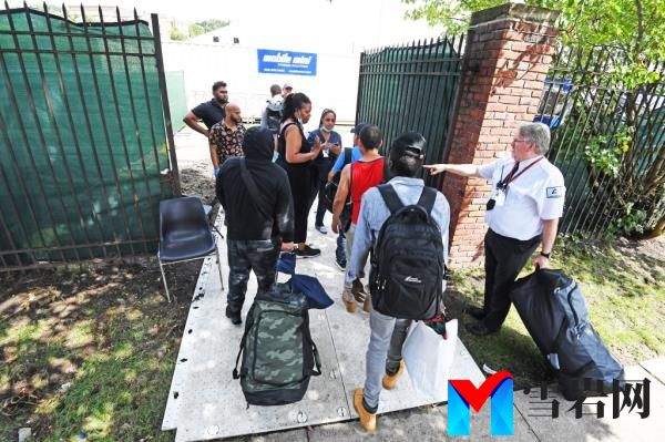 Migrants arriving at the shelter at the former Creedmoor Psychiatric Center on August 16, 2023.