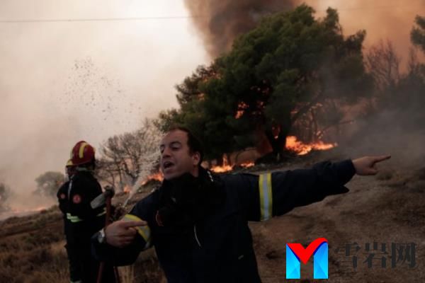 epa10813671 Fire Lieutenant Argyris Makaro<em></em>nas directs his crew while battling flames of a wildfire at the area of Fyli near Athens, Greece, 22 August 2023. A wildfire is in progress in Fyli, west Attica region. So far, 26 firefighters with 13 vehicles are operating, while air forces have also been mobilized. EPA/KOSTAS TSIRONIS