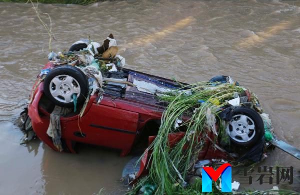 Overturned car submerged in a river due to flash floods in Taboao da Serra district, Sao Paulo, Brazil.