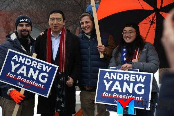 KEENE, NEW HAMPSHIRE - FEBRUARY 11: Democratic presidential candidate Andrew Yang take a photo with supporters who are holding campaign signs in front of a polling station on February 11, 2020 in Keene, New Hampshire. New Hampshire holds its first in the nation primary today. (Photo by Justin Sullivan/Getty Images)