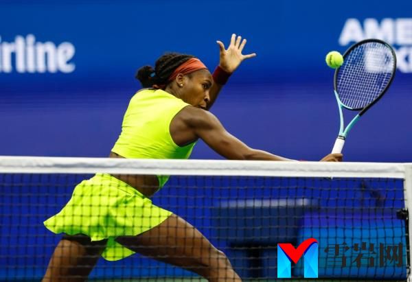 Coco Gauff of the USA,  returns a volley to defeat Elise Mertens of Belgium