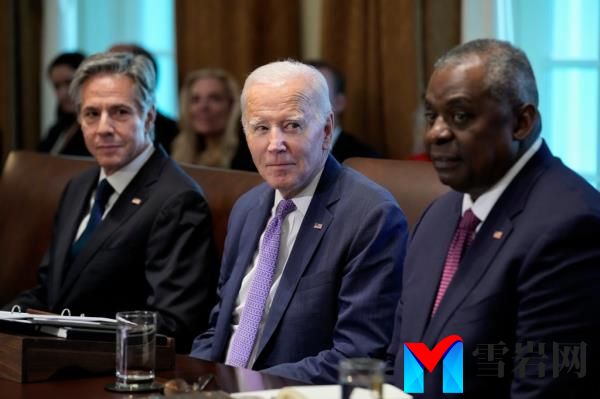 Secretary of State Antony Bl<em></em>inken, left, President Joe Biden and Defense Secretary Lloyd Austin, right, attend a cabinet meeting.