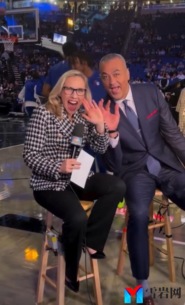 Kate Scott and Alaa Abdelnaby prior to a 76ers game.