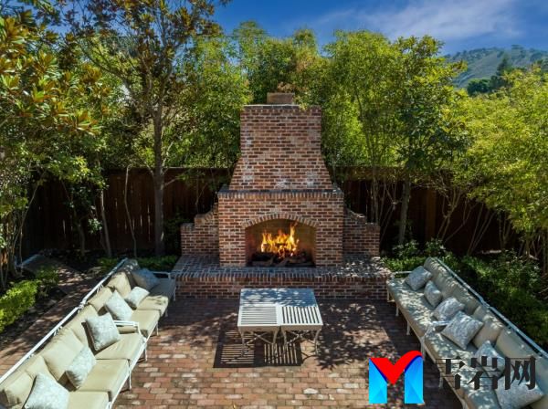 Outdoor seating and fireplace.