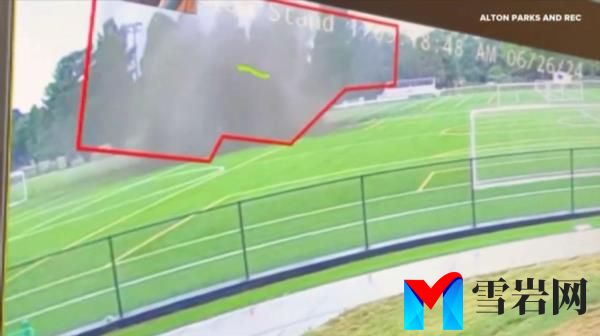 The sinkhole sent dust flying out after swallowing a large part of the soccer field. 