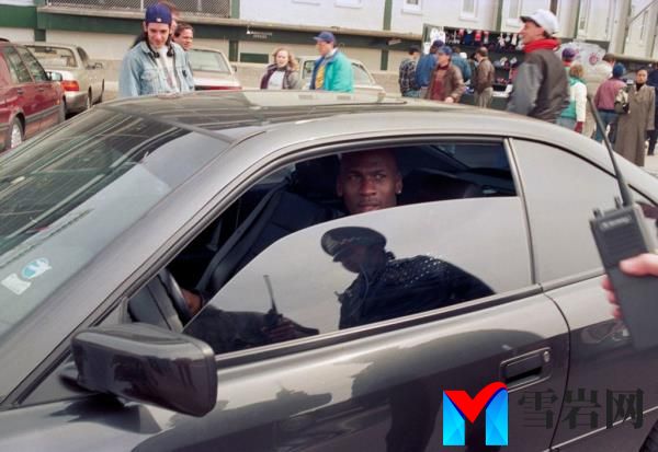 Michael Jordan driving a car outside Wrigley Field on opening day, April 4, 1993 in Chicago, Illinois, United States. 