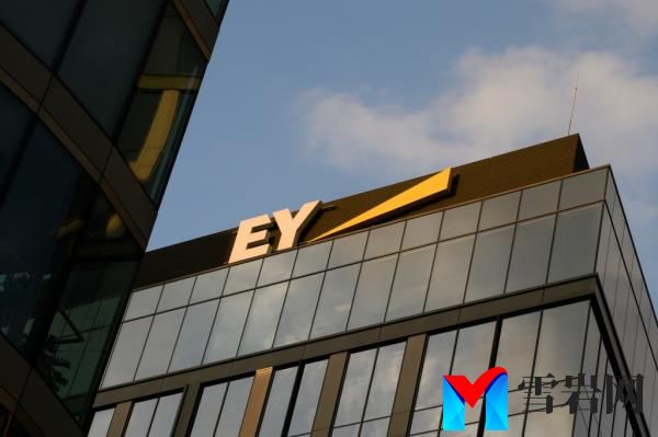 EY logo on office building.