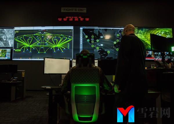 Perso<em></em>nnel pose for photos in the cyber operations center at Lasswell Hall aboard Fort Meade, Maryland, Feb. 5, 2020.