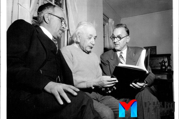 Professor Albert Einstein receives a birthday book of messages presented by the Albert Einstein College  of Medicine on his 75th birthday on March 14, 1954.